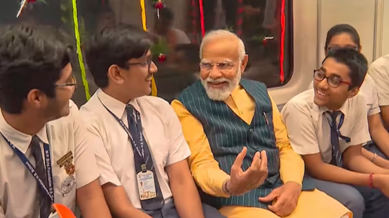 PM Modi travels with school students in India's first underwater metro train in Kolkata